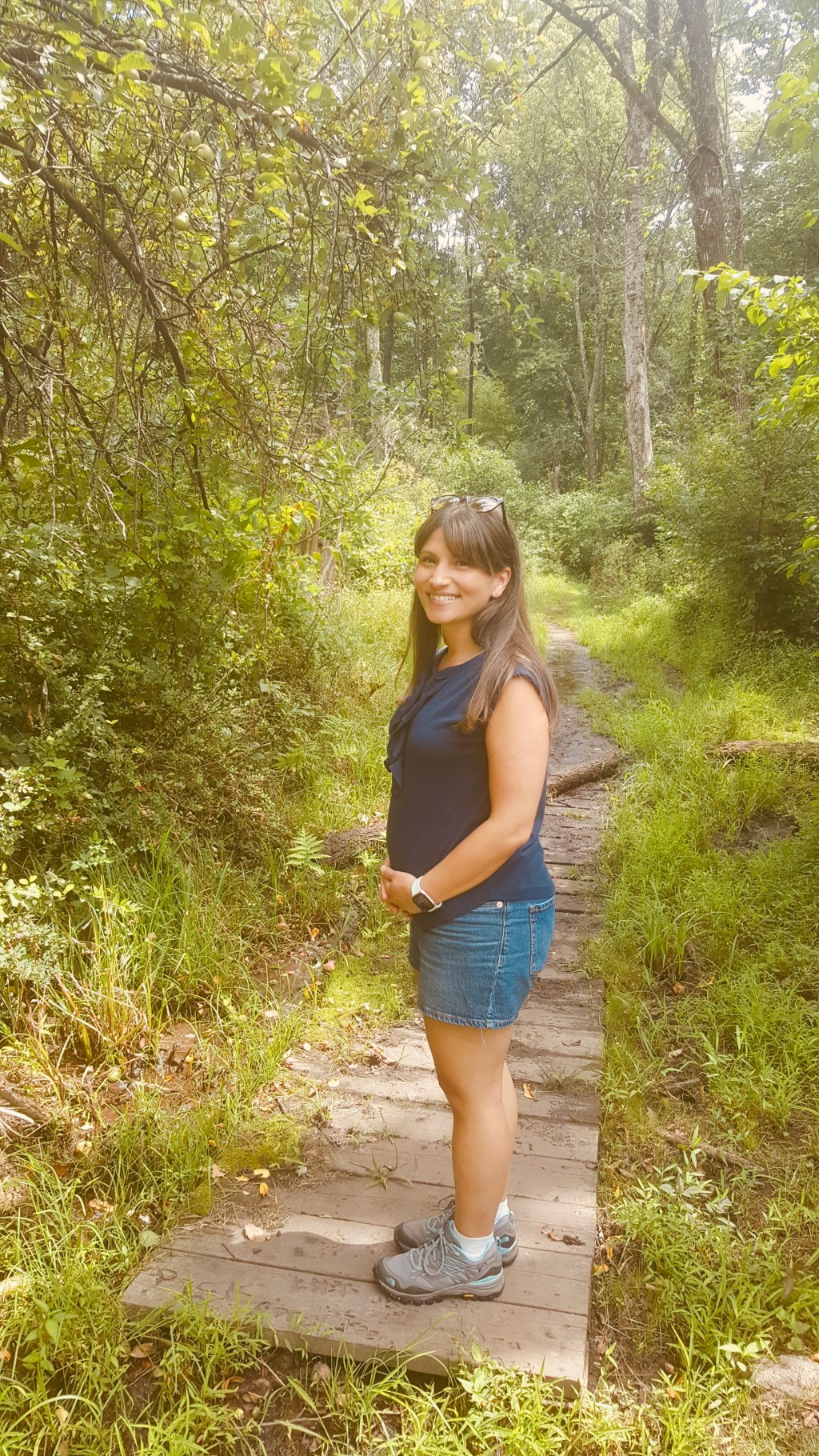 Pregnant mother on a peaceful nature hike, cherishing quiet moments with her baby girl during pregnancy before loss